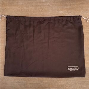 Coach dark brown medium dust bag w/ivory logo and drawstring, 19.5” x 15”